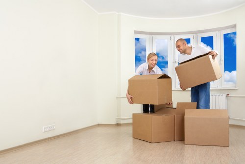 Furniture and boxes being loaded into a moving truck